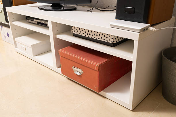 istock White TV stand with storage boxes and media devices 2252769686