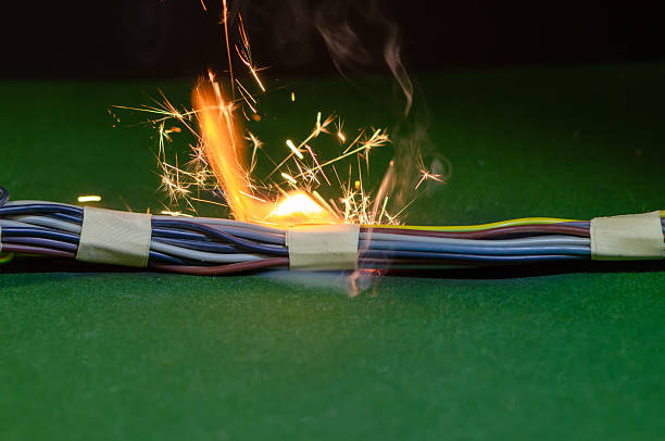 istock Bright electric sparks escape from a bundle of cables during a short circuit. 2252770824