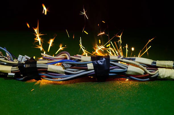 istock Short-circuit sparks escape from electrical cables during an accident. 2252770846