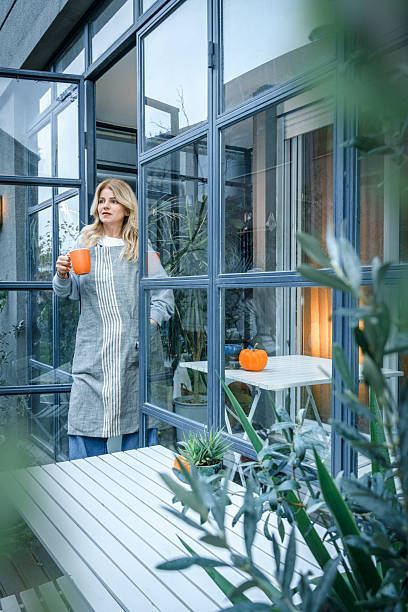 istock Woman owner relaxing with coffee cup in botanical cafe 2252770855