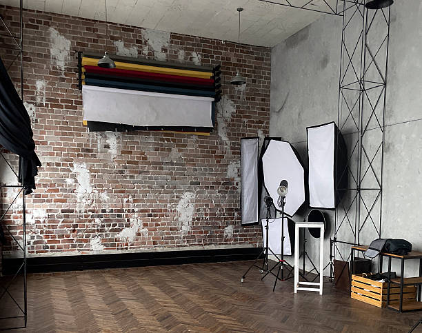 istock Spacious studio with brick walls features professional lighting equipment and backdrops 2252772677