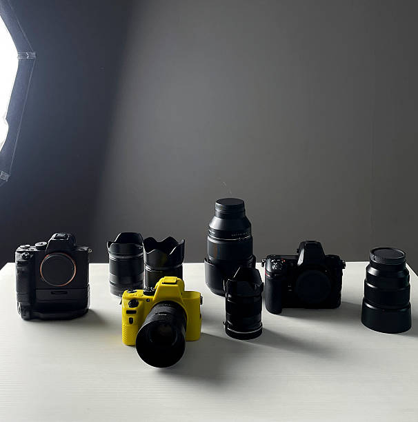 istock Different cameras and lenses are placed neatly on a table, showcasing their design and features 2252772780