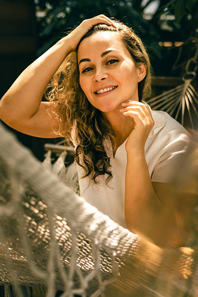 istock Mature woman smiling outdoors in warm natural light with relaxed positive expression 2252774237