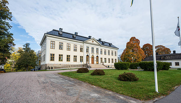 istock Historic manor building with autumn trees in bright daylight Buildings/Landmarks. 2252774591