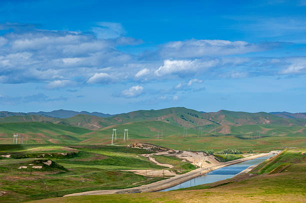 Springtime view of California coast range with the California Aqueduct in foreground.Taken in Central Coast of California.