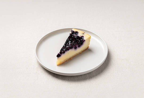 istock Slice of blueberry cheesecake on white plate 2252776119