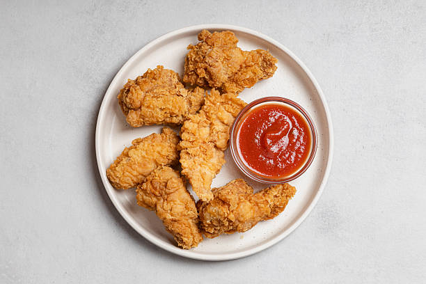 istock Top View Plate of Crispy Chicken Strips and Wings 2252776152