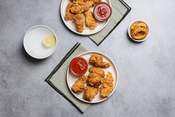 istock Two Plates of Crispy Chicken Tenders 2252776171