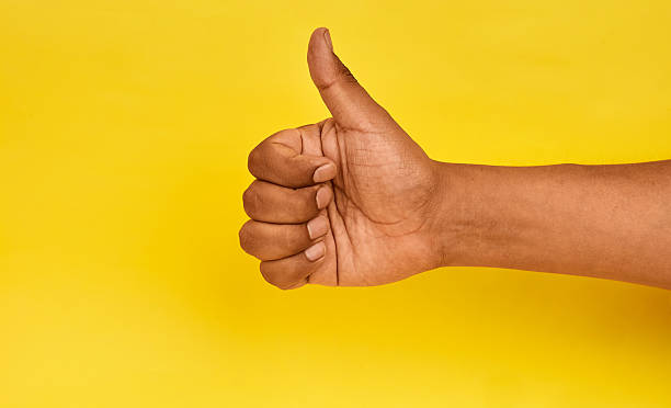 istock A hand giving a thumbs up to symbolize approval, positive evaluation and supportive encouragement toward progress. 2252777315