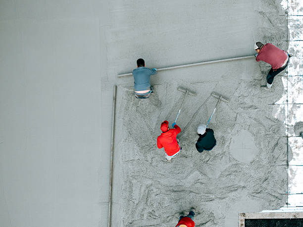 istock Men Work Pouring Concrete Slab At Home Build 2252779519