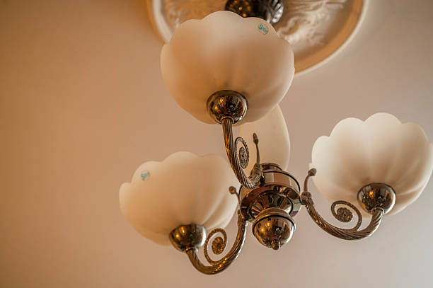 istock Vintage chandelier distributing warm light in an interior 2252782190