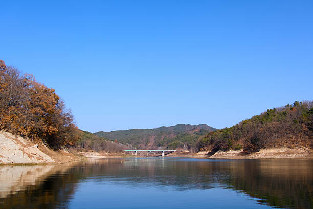 istock Blue sky, calm river, and autumn mountain 2252786913