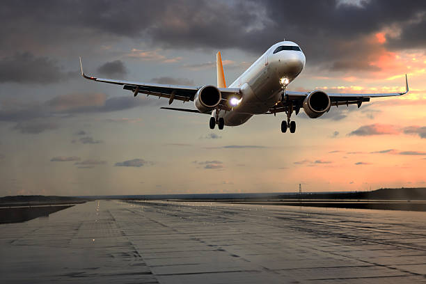 istock Passenger airplane landing at sunset 2252789691