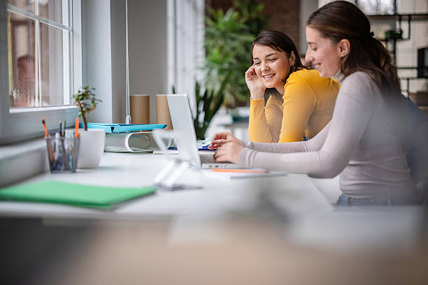 istock Colleagues work together in a modern office space during the day with technology and teamwork 2252797063