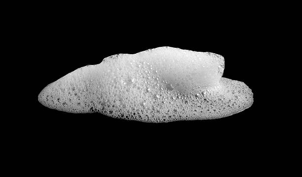 istock White foam bubble isolated on black background, symbolizing cleanliness, freshness, and hygiene. Perfect for design projects related to cleaning products, beauty, and soap advertising. 2252797093