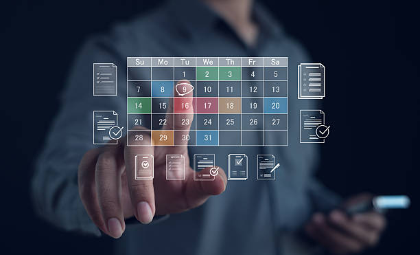 istock Business professional selecting date on virtual digital calendar with document verification icons, representing online scheduling, deadline management, workflow control and business productivity. 2252800407