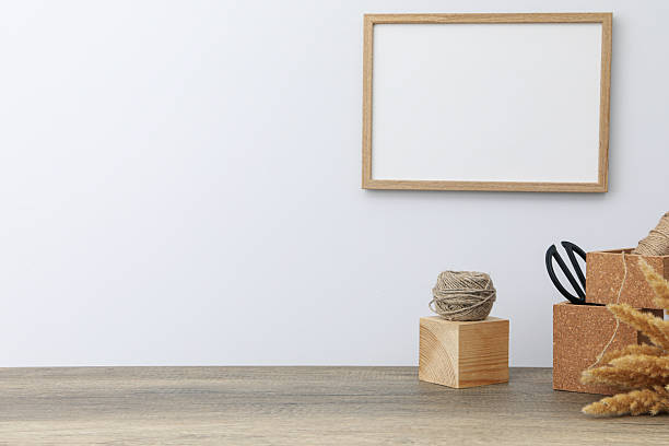 istock A wall frame and an easel on a craftsman's desk 2252800442