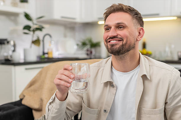 istock Young man drinks water big sip healthy habit hydration focus energy pause refresh wellness routine 2252806742