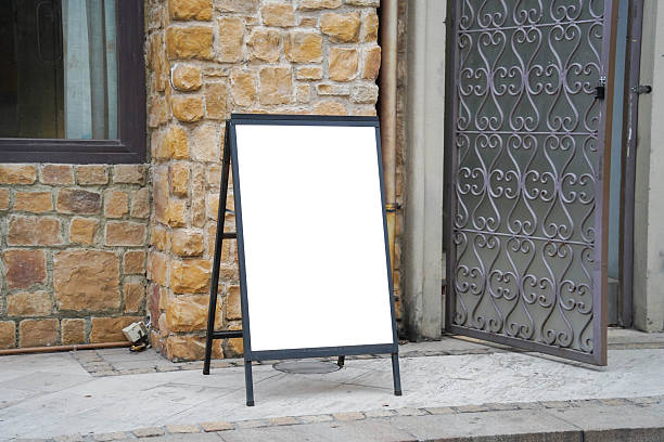 istock Blank white outdoor advertising stand sandwich board mock up template. 2252807677