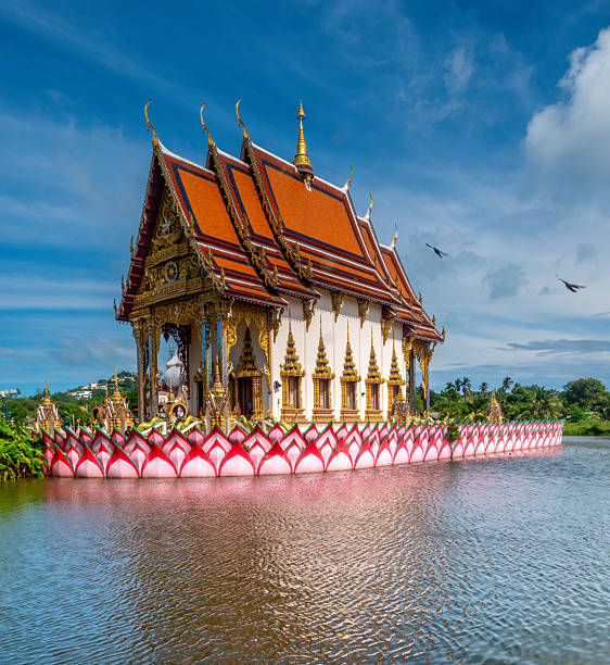Thai buddhist temple surrounded by a moat in the Wat Plai Laem temple complex, Koh Samui, Thailand