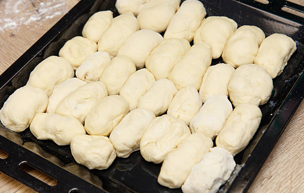 istock A tray of doughnuts are sitting on a table 2252812026