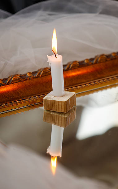 istock A candle is lit on a wooden block 2252812729