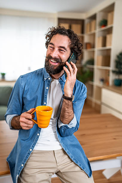 istock Happy man laughing on phone call feeling good 2252817899