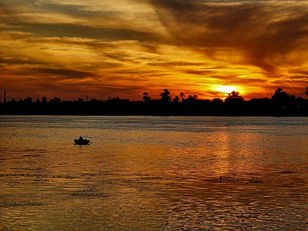 istock Landscape view of large river with dramatic sunset and clouds 2252818296