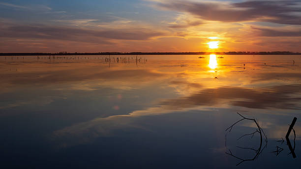 istock Lake Sunset with Boats and Reflections 2252818973