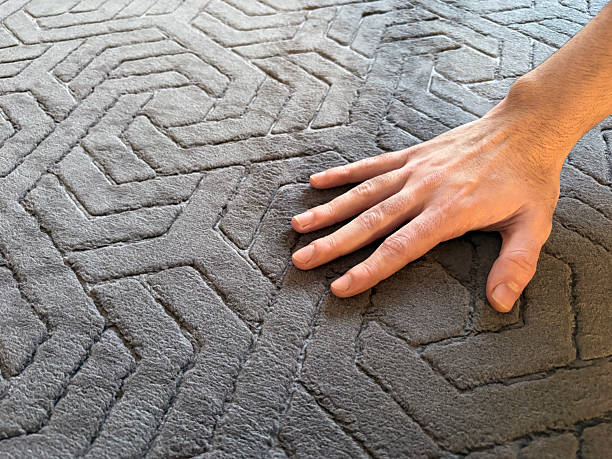 istock Hand on the carpet surface. Hand touching soft carpet 2252819972