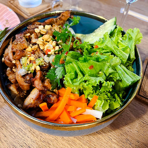 istock Salad with bliled carrots and fried roasted pork 2252821107