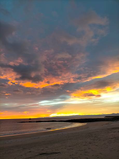 istock fire in the sky as sunrise develops in Burela, Spain 2252824847