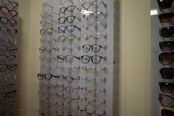 istock Large Selection of Various Eyeglass Frames and Designer Sunglasses Displayed Professionally in a Modern Optical Retail 2252828329