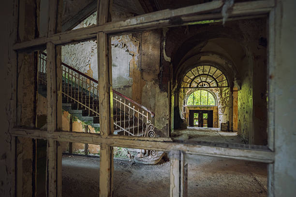 Exterior of a building in Beelitz Heilstätten with trees and ivy