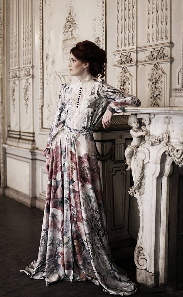 istock woman  posing next to the fireplace 2252830449