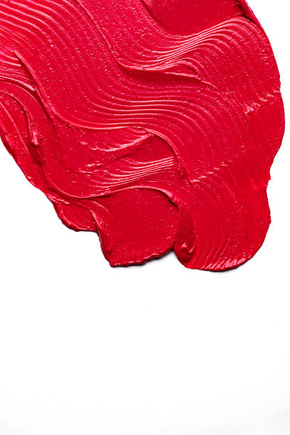 istock Abstract texture background of a red lipstick smear. 2252830877