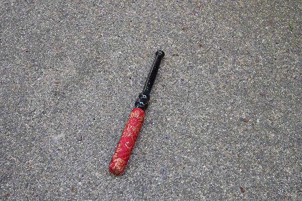 istock A red and gold cane is laying on the ground 2252836339