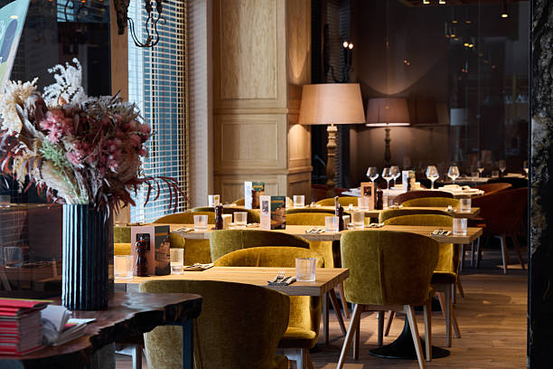istock sunny cafe with elegant decor, luminous restaurant featuring plush seats and charming accents 2252839428