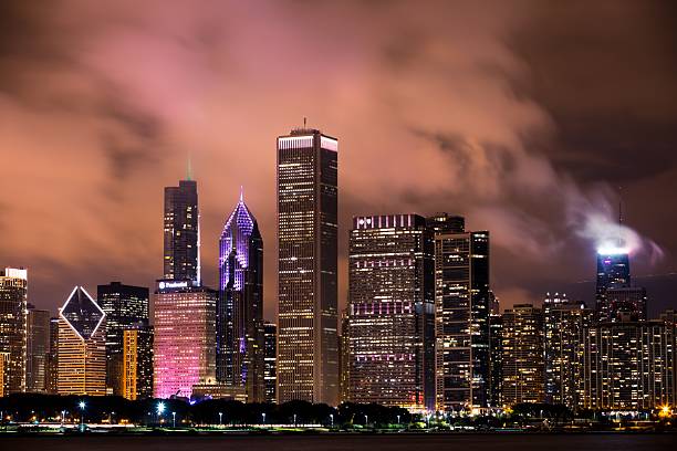 Business city. Night cityscape of Chicago skyscraper building. Chicago architecture of skyscraper. City night illuminated building. Skyscraper cityscape. Night city of Chicago. Vibrant atmosphere.