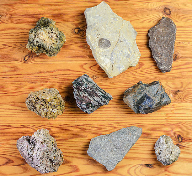 istock Collection of diverse geological rock samples displayed on a warm wooden surface 2252845696