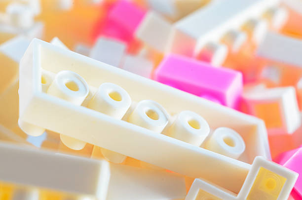 Close-up of interlocking plastic building blocks in pastel colors, creating a playful and creative scene