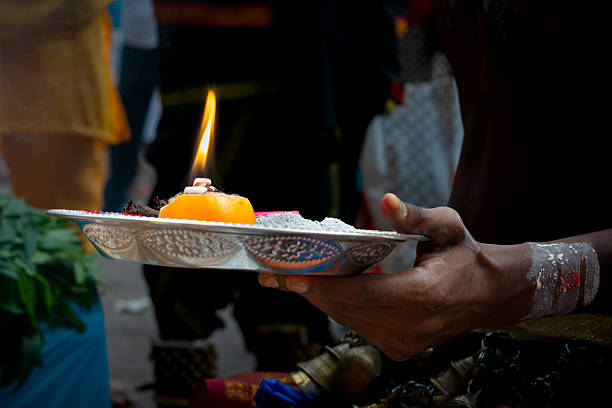 istock Hindu Ritual Offering with Flame and Orange 2252848745