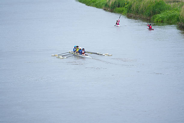 Looking down on rowers in canoes on the River Wensum in Norwich. August 2023