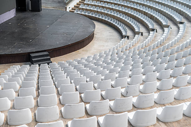 istock Empty seating area facing a stage in an outdoor venue during a sunny day 2252860650