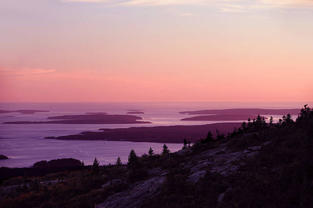 istock dawn pink light sky before sunrise above Atlantic Ocean with island silhouette 2252860666