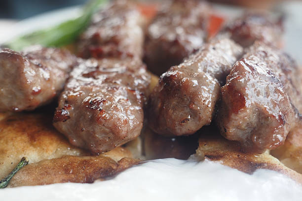 istock Delicious grilled meat skewers served with bread 2252861145