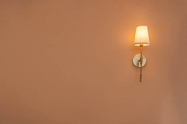 Warm light wall lamp decorated on pink wall