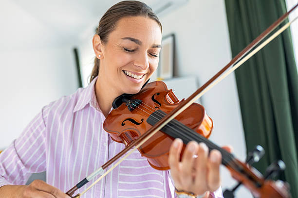 istock Young Female Musician Playing Violin Passionately 2252862173