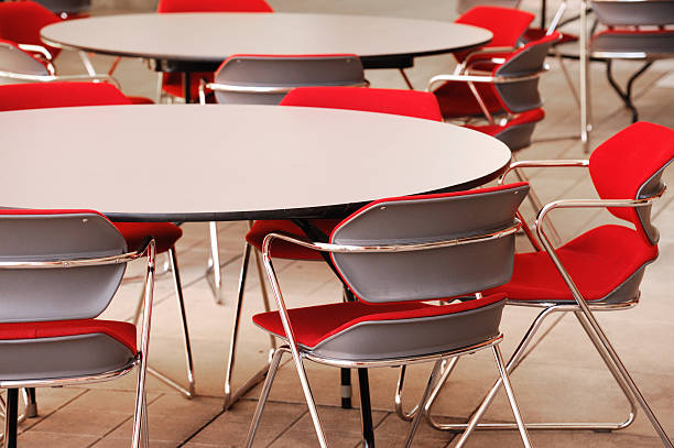 istock close up on round tables and chairs in cafeteria 2252863577