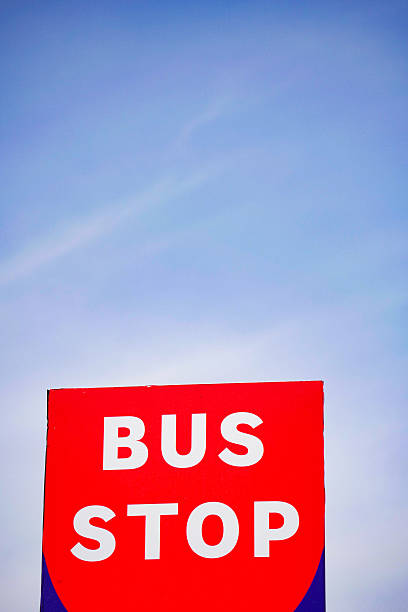 istock Brightly colored bus stop sign against a clear sky 2252864008